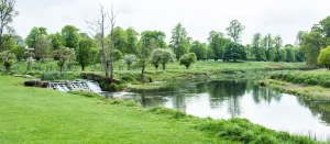 charlecote garden stunning landscape with lake and green grass and tress